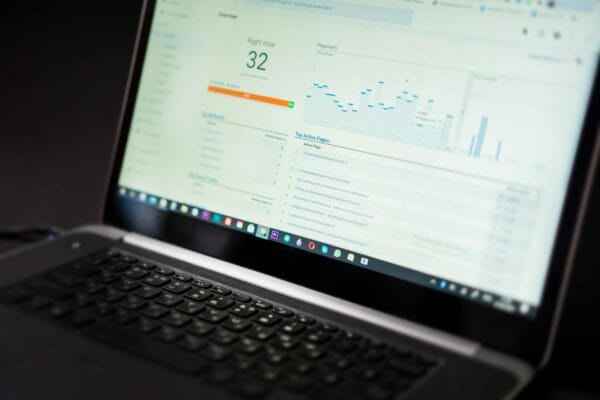 what is geo in seo - A laptop displaying an analytics dashboard with real-time data tracking and analysis tools.