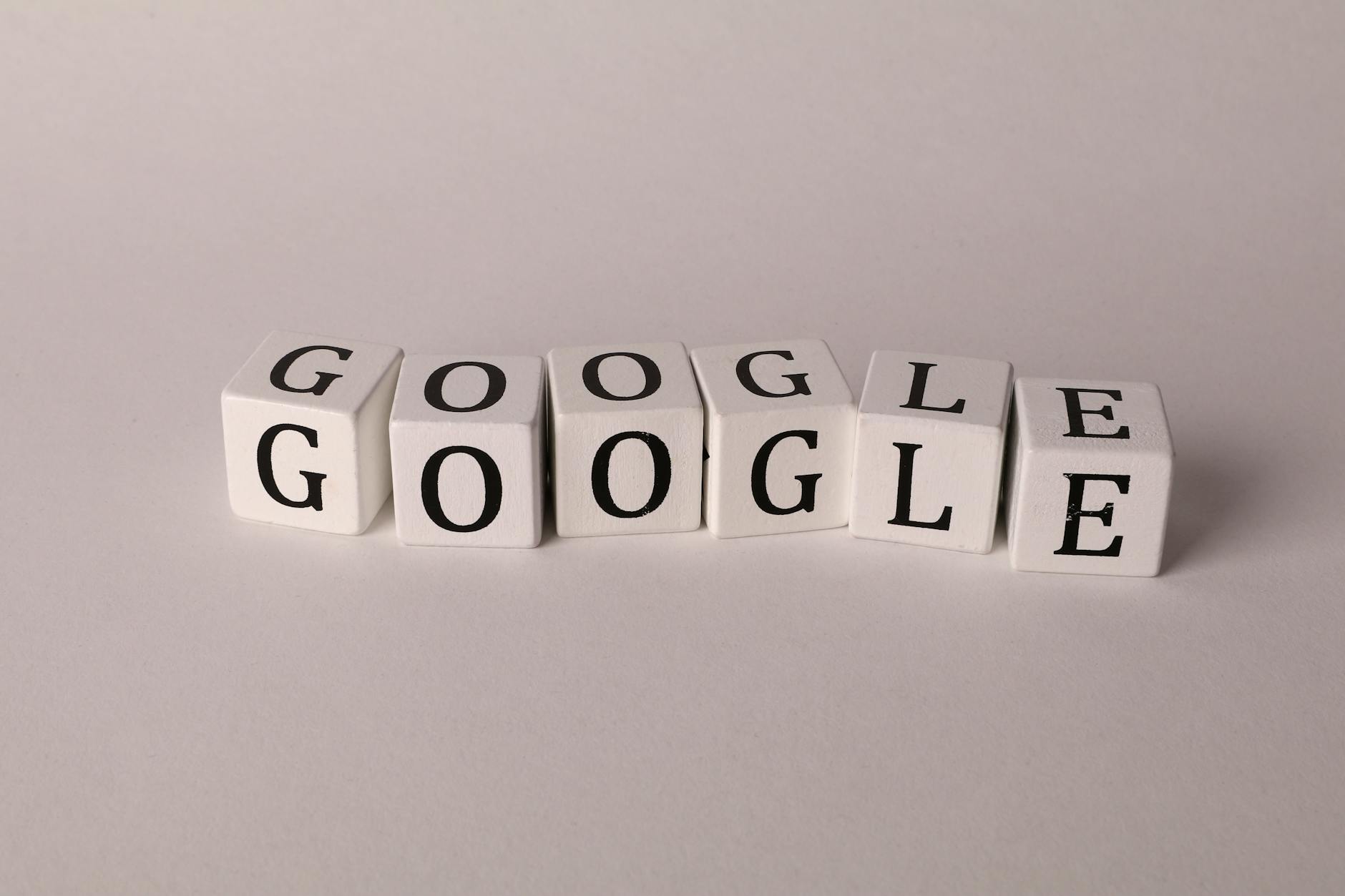 AI dalam SEO - White blocks with letters spelling Google, symbolizing search and SEO concepts.