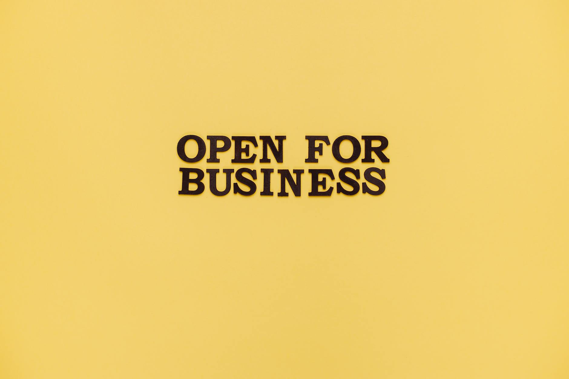link dofollow berkualitas - Bold 'Open for Business' text on a vibrant yellow background for advertising.
