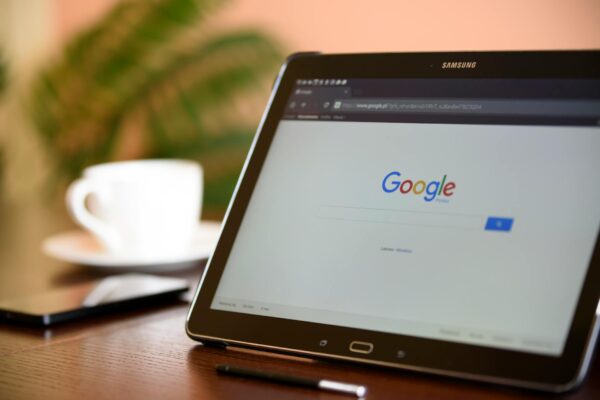 zero click search - Samsung tablet on desk showing Google homepage, perfect for technology-related content.