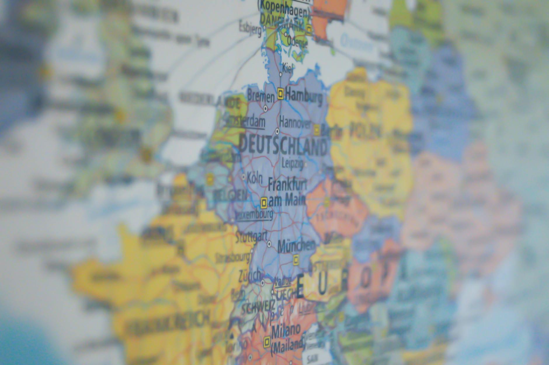 cara menaikkan ranking Google Maps - Close-up view of Germany on a colorful world map showing major cities.