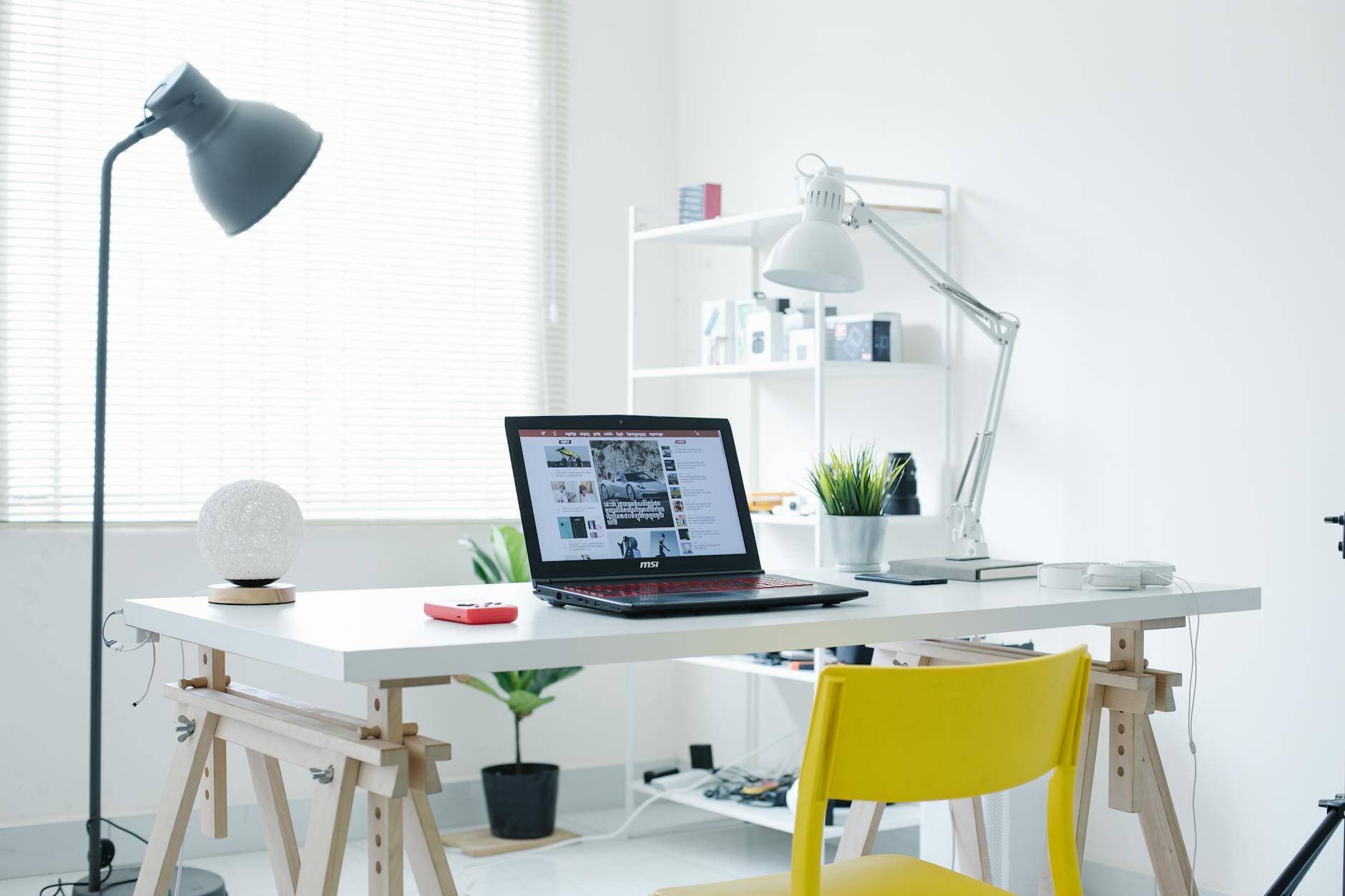 improve readability score - A bright white home office featuring a laptop and sleek contemporary design elements.